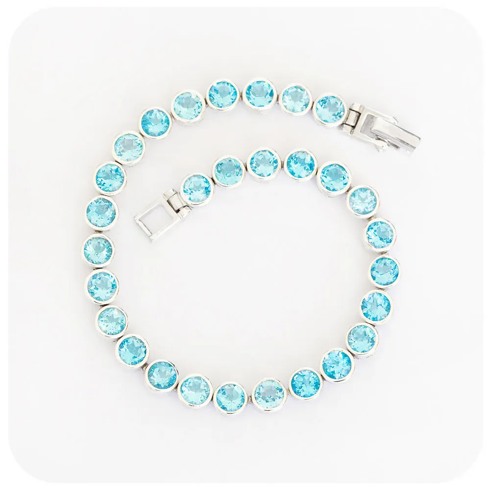 Round cut Swiss Blue Topaz Tennis Bracelet in Sterling Silver