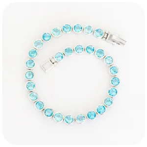 Round cut Swiss Blue Topaz Tennis Bracelet in Sterling Silver